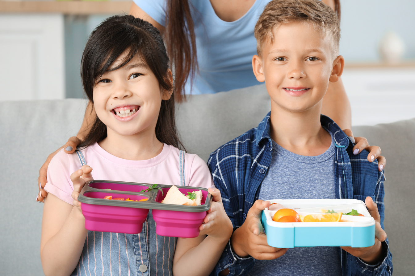 Little Children with Lunch Boxes before School